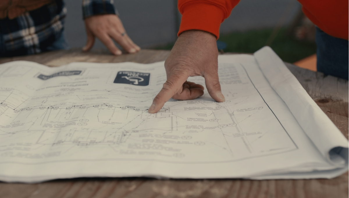 Construction team reviewing project drawings on site
